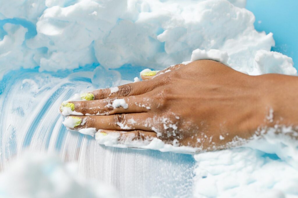 Close-Up Shot of a Person Touching Shaving Foam