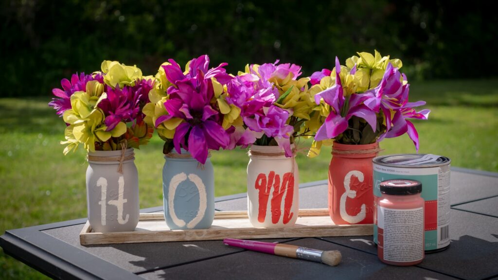 pink and yellow petaled flower lot on desk