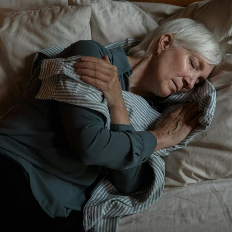 An Elderly Woman Lying on the Bed