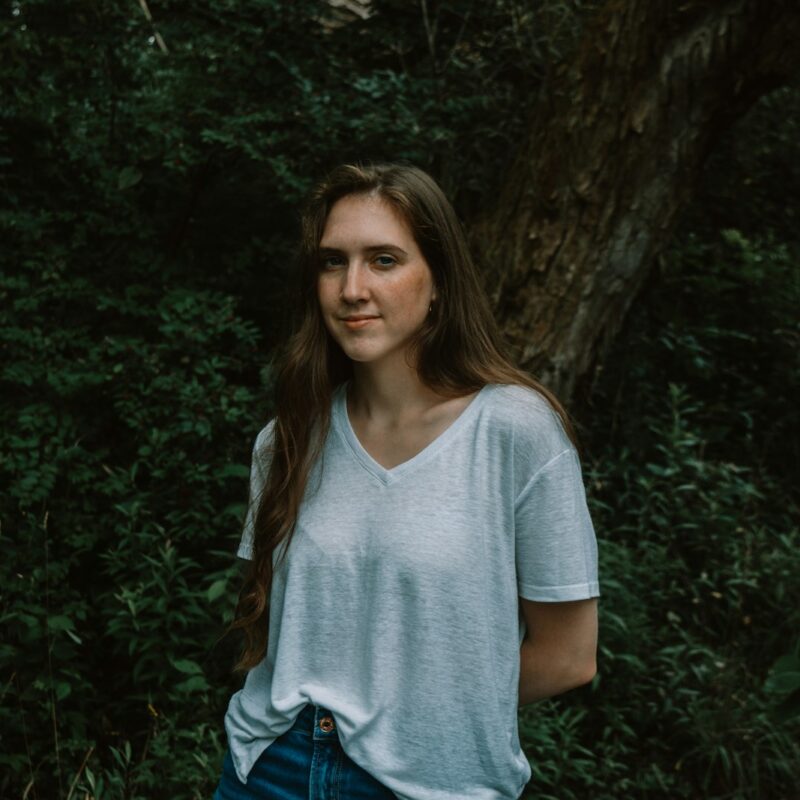 a person standing in a forest