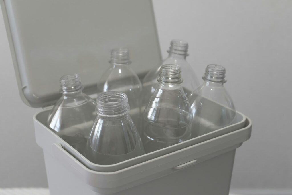 A cooler with six bottles of water in it